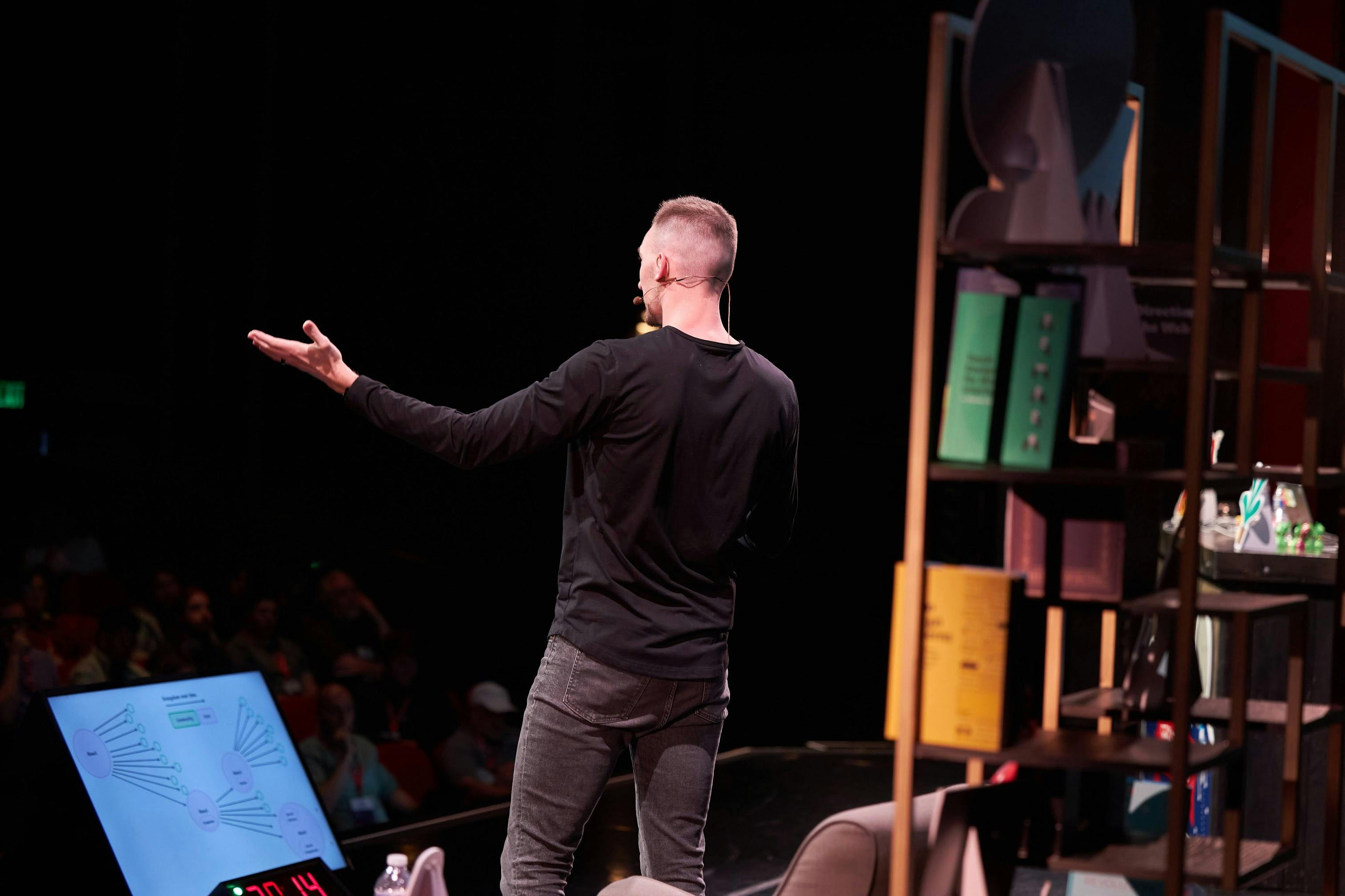 Me standing on stage at SmashingConf giving a talk about my optimism for the web